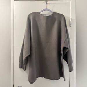 Oversized knit sweatshirt with distressed elements. Size XS.